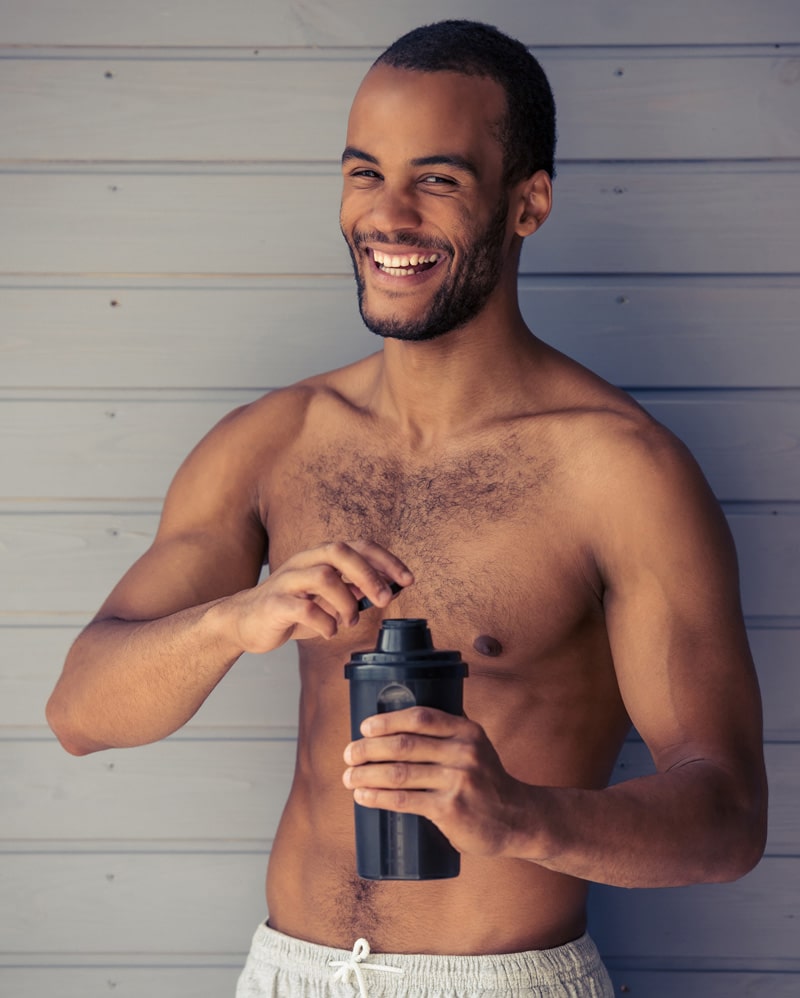 Men smiling Drinking Protien Shake